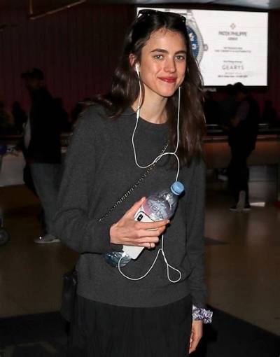 Bitchy | Margaret Qualley Jets into Lax with a Smile on Her Face
