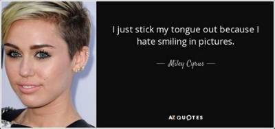 Miley Cyrus: ‘I Just Stick My Tongue out Because I Hate Smiling in Pictures’