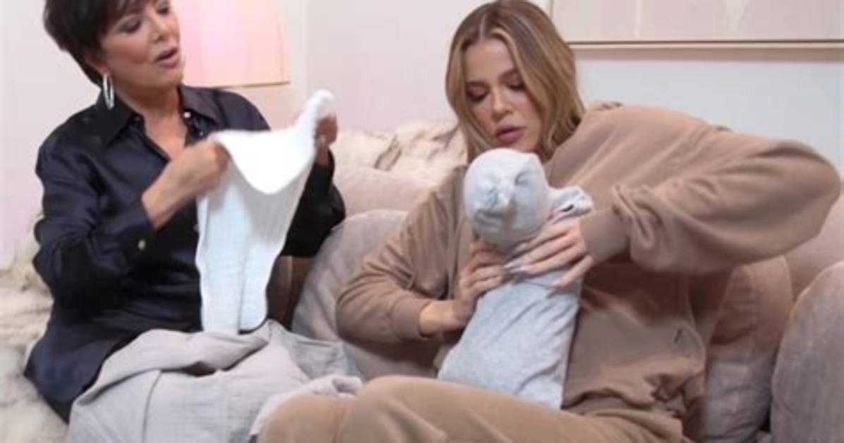 See Khlo%C3%A9 Kardashian Cuddle with Magic Baby 400. Jpg
